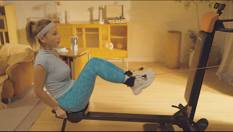 Barefoot model using Ankle straps on U-trainer Plus for leg stretches